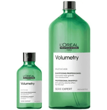 Two green Volumetry shampoo bottles from L'Oréal, one small and one large, with white labels.