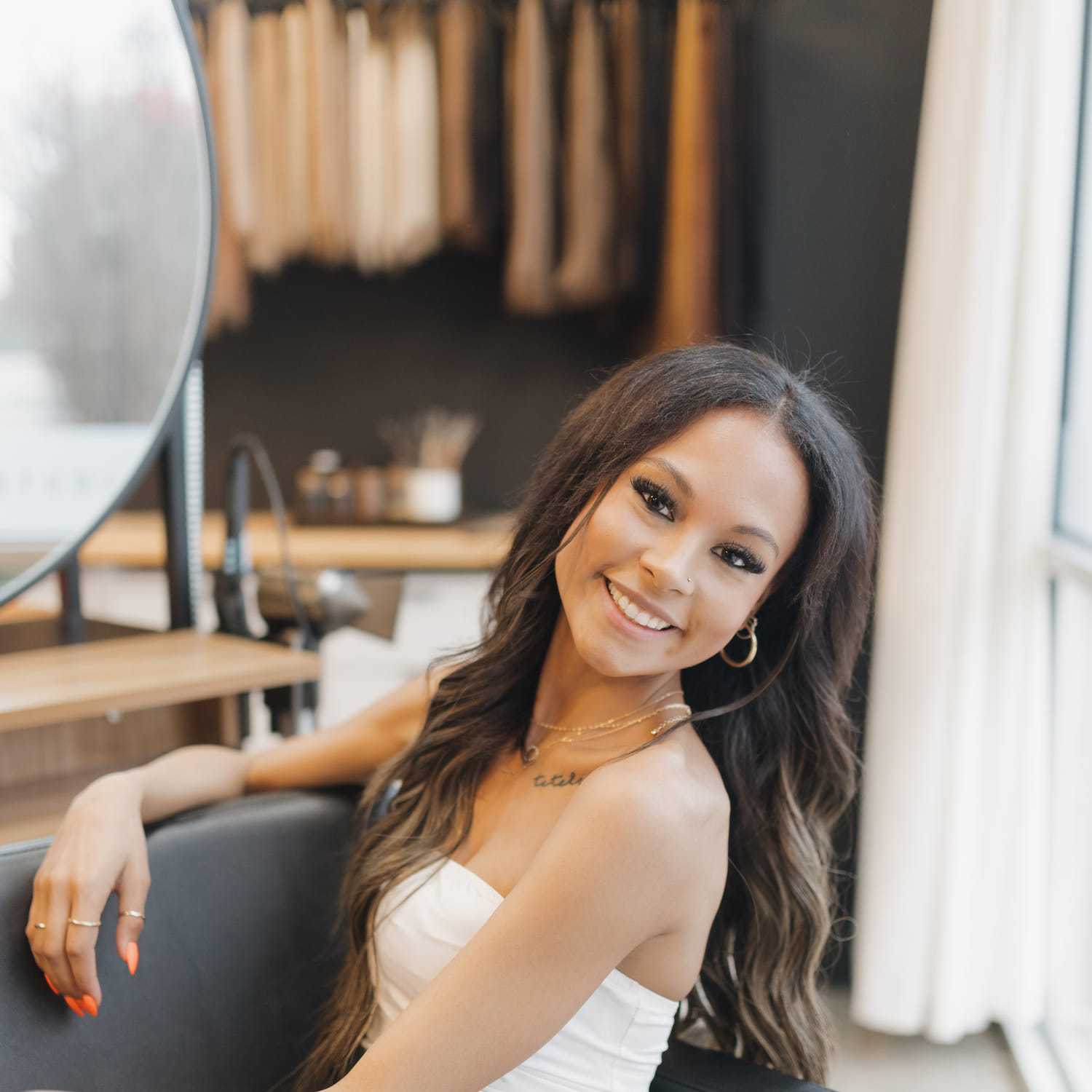 Portrait of ASHLEY GRIFFIN, a professional stylist at KAYCE + CO, showcasing their expertise and style.
